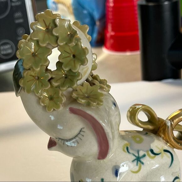 A decorated Elephant? Ceramic. Pink ears. Nose in air. Flowers on trunk. Eyelash - Picture 14 of 14